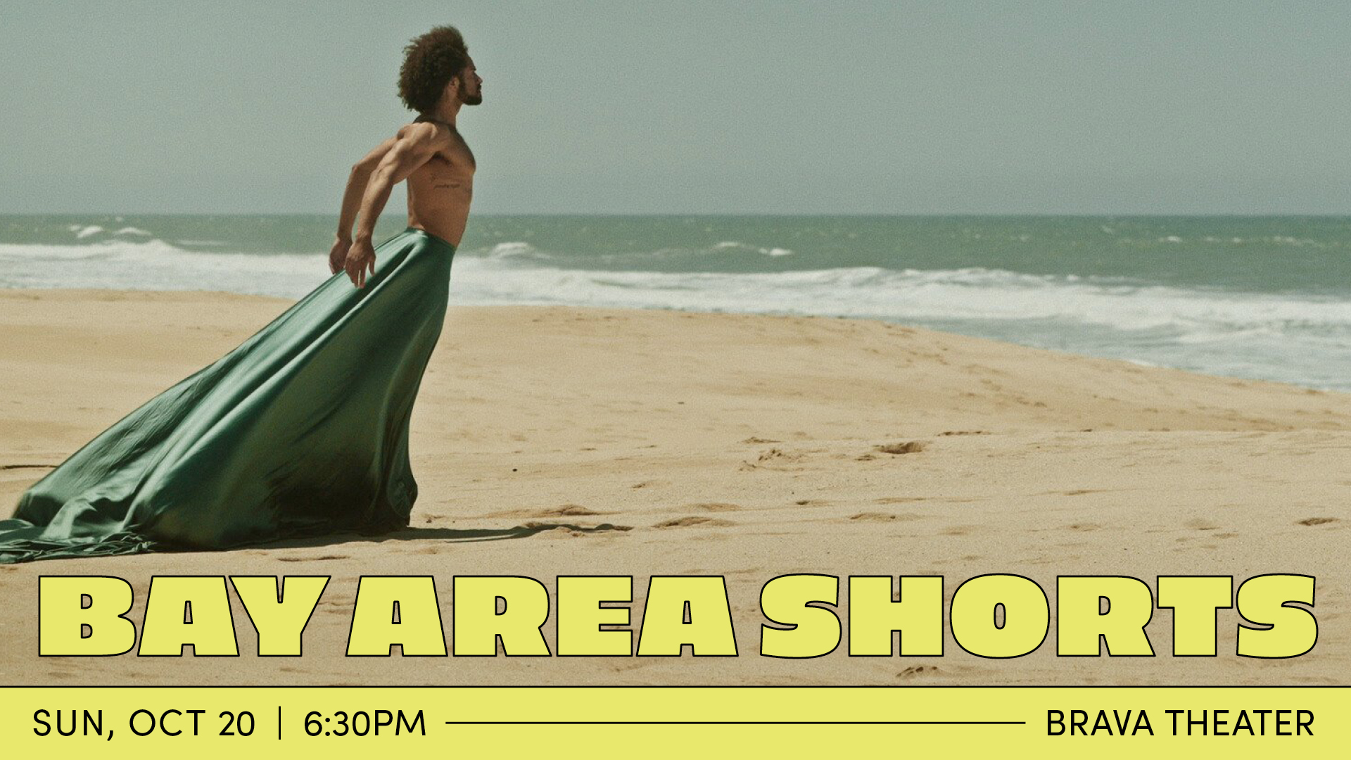 A black dancer, wearing a long blue green skirt, stands chest out facing the ocean. Yellow text reads, "Bay Area Shorts: Sun, Oct 20th, 6:30pm, Brava Theater."